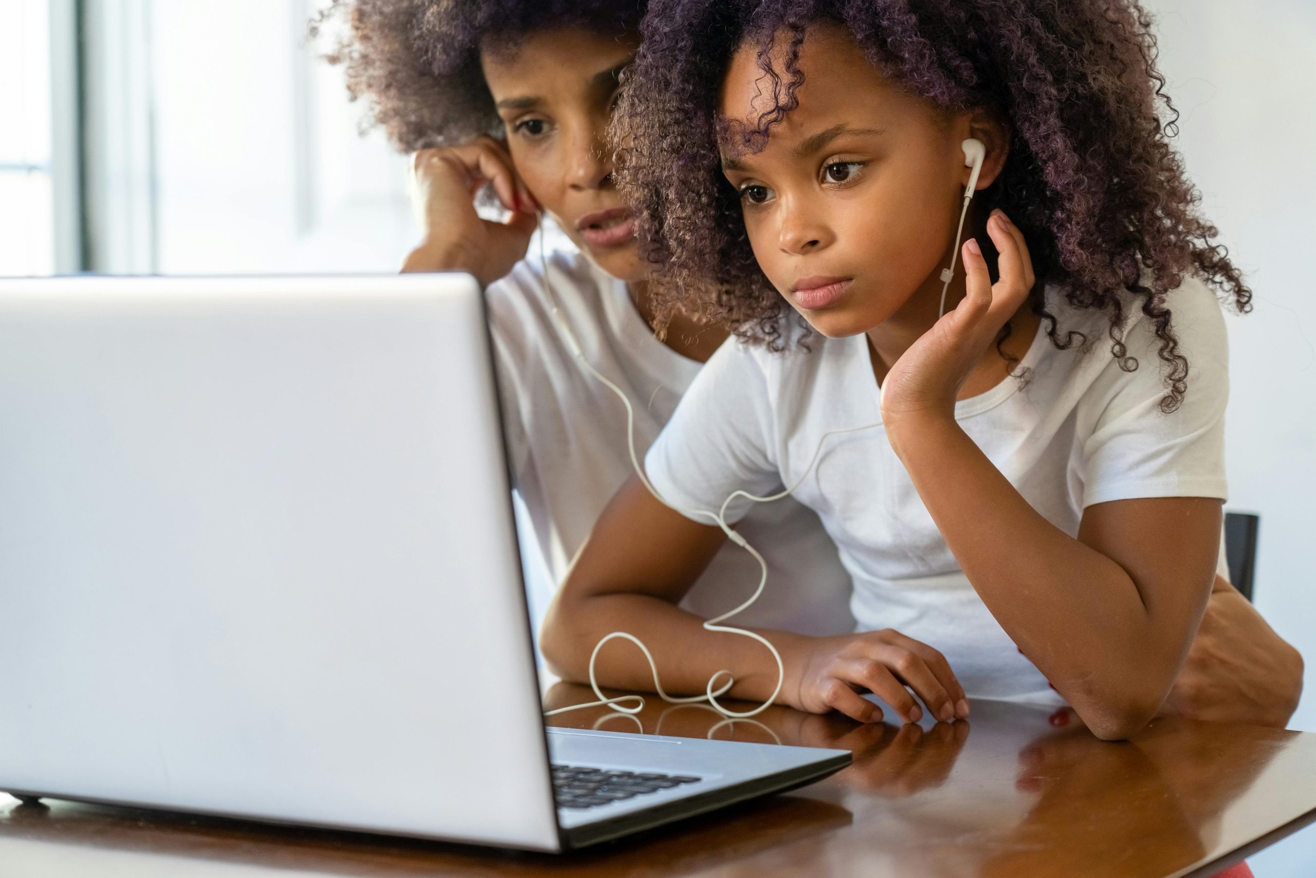 adult and child with laptop